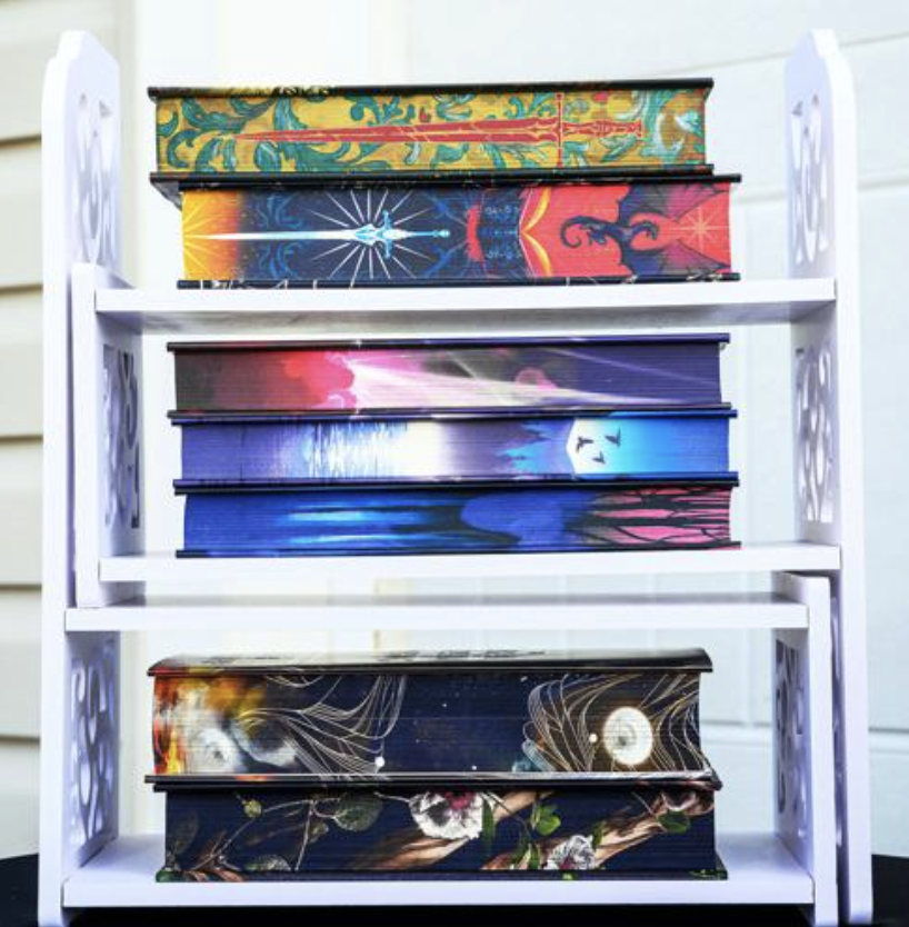 A colorful stack of decorated books on display